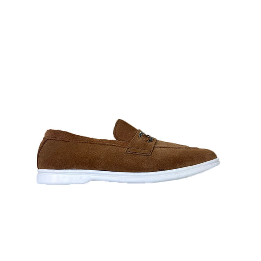 Tan suede loafer, back heel view showing white outsole